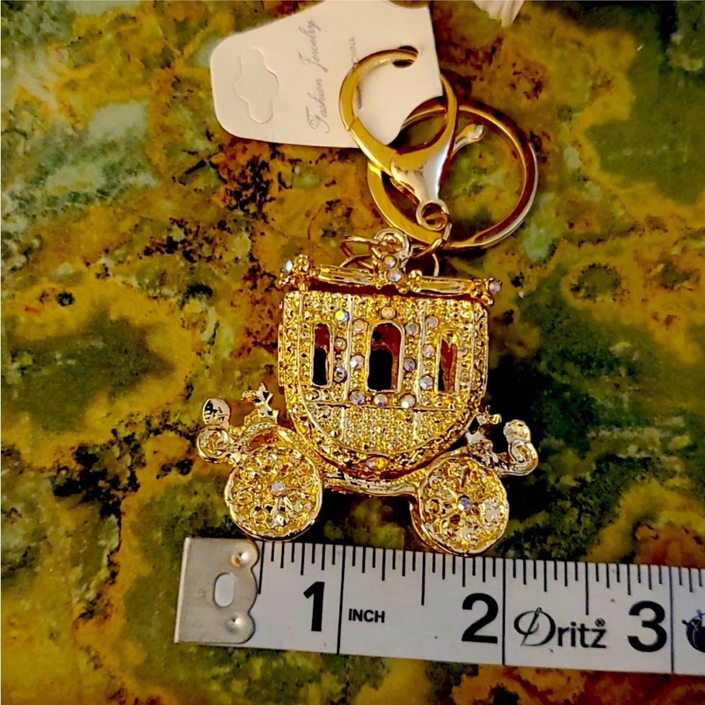 New gold, rhinestone carriage bling out your purse, or use it as a keychain